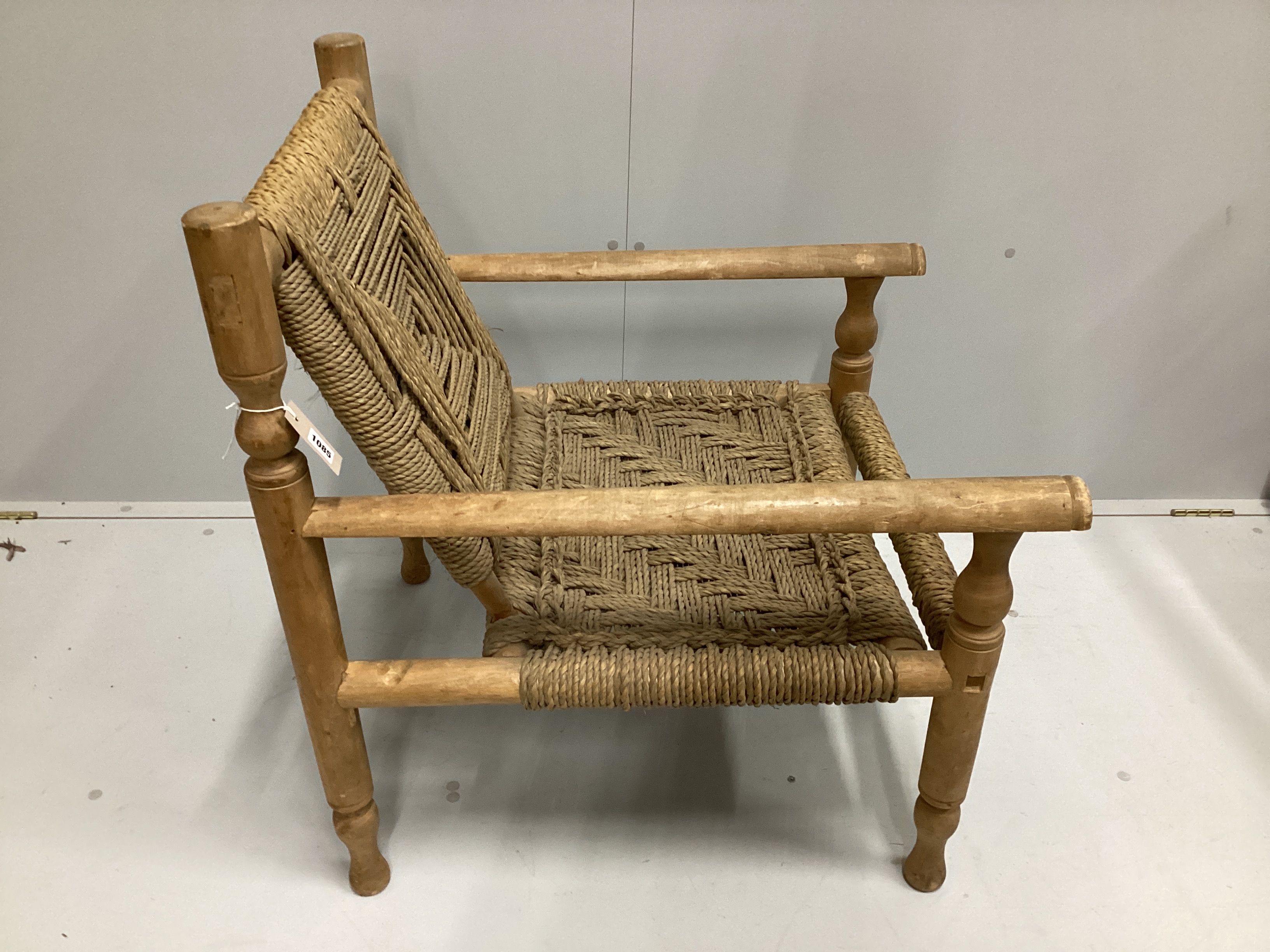 In the manner of Adrien Audoux and Frida Minet a sisal weave beech elbow chair, width 63cm, depth 74cm, height 81cm.